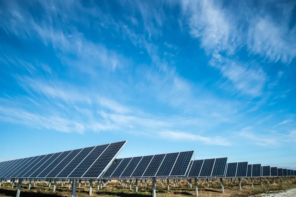 Solar panels extending across an open site