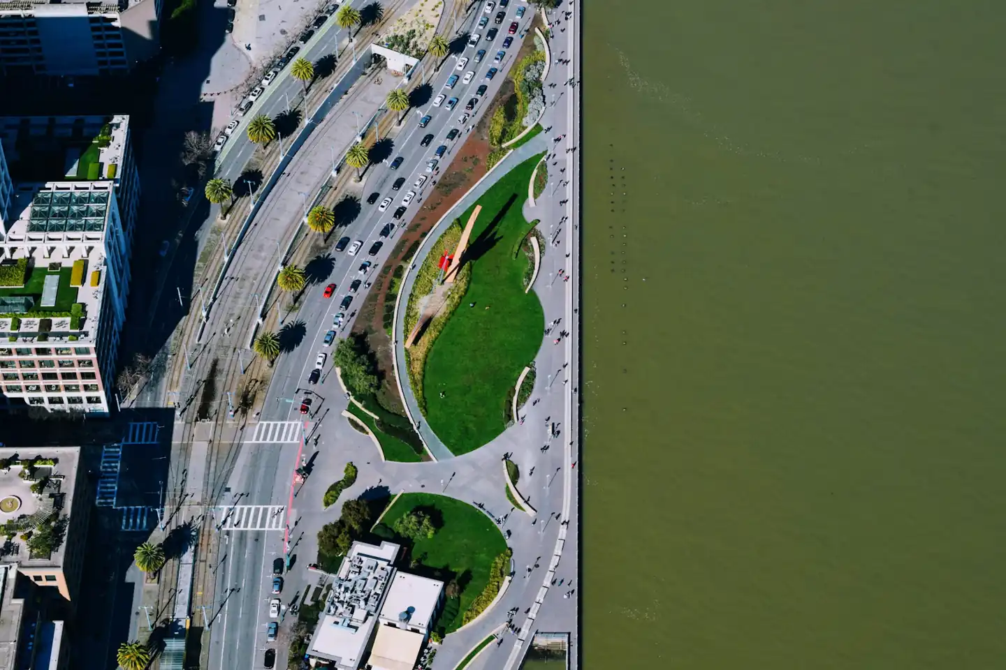 Aerial view of a river and landscaped city edge