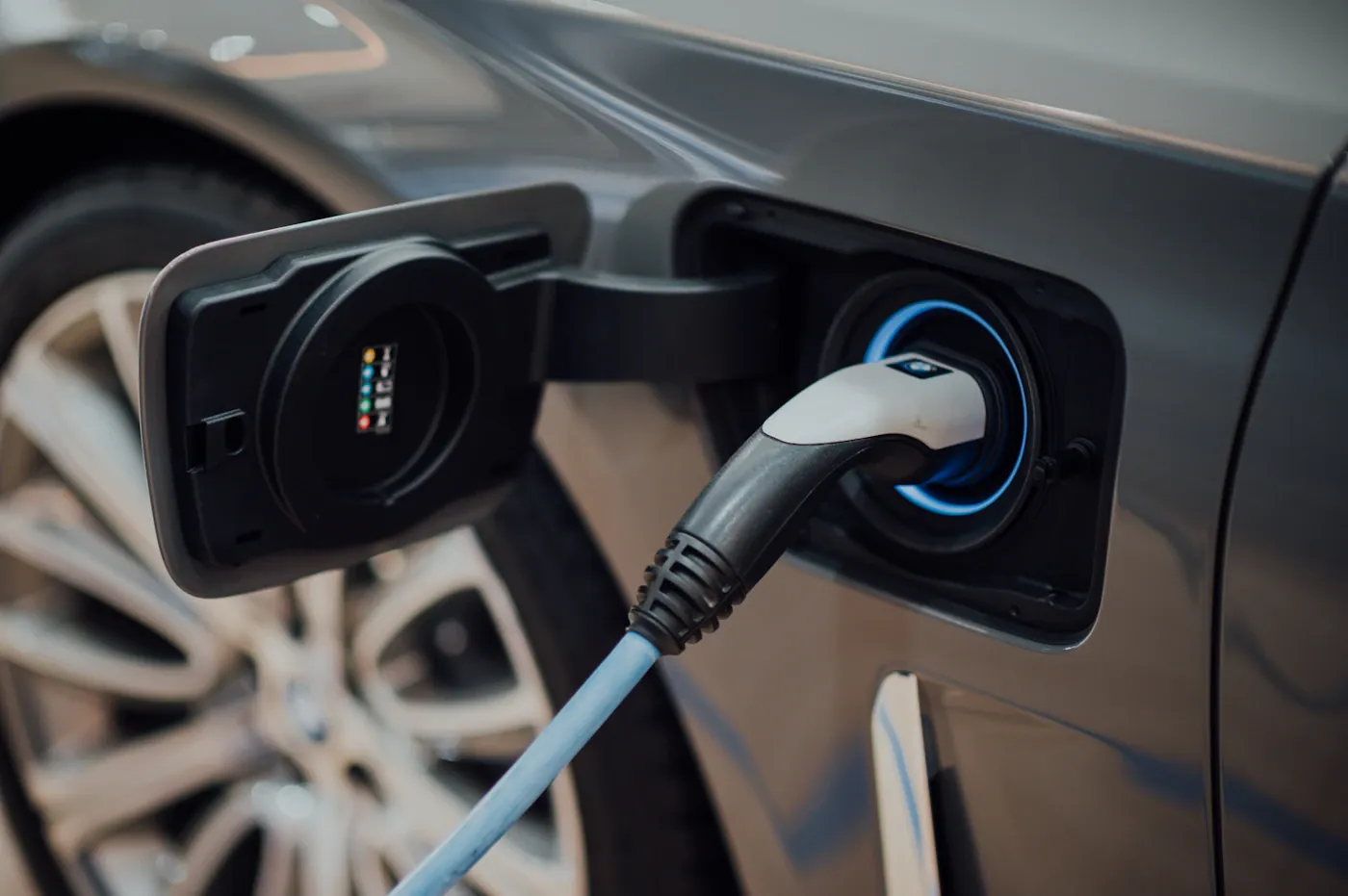 Charging connector attached to an electric car