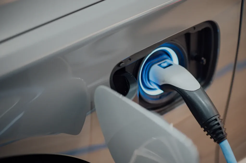 Electric vehicle charging cable at a parked car