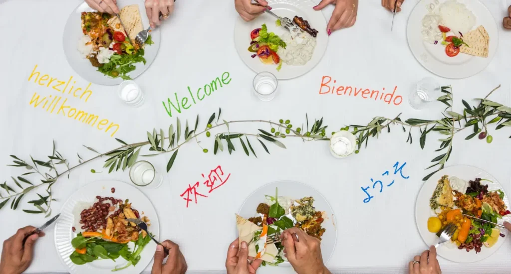 Overhead view of food and place settings at a communal meal