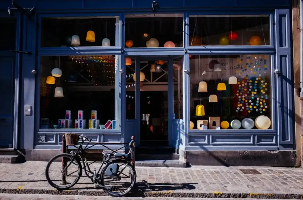Shopfront with windows and a bicycle outside