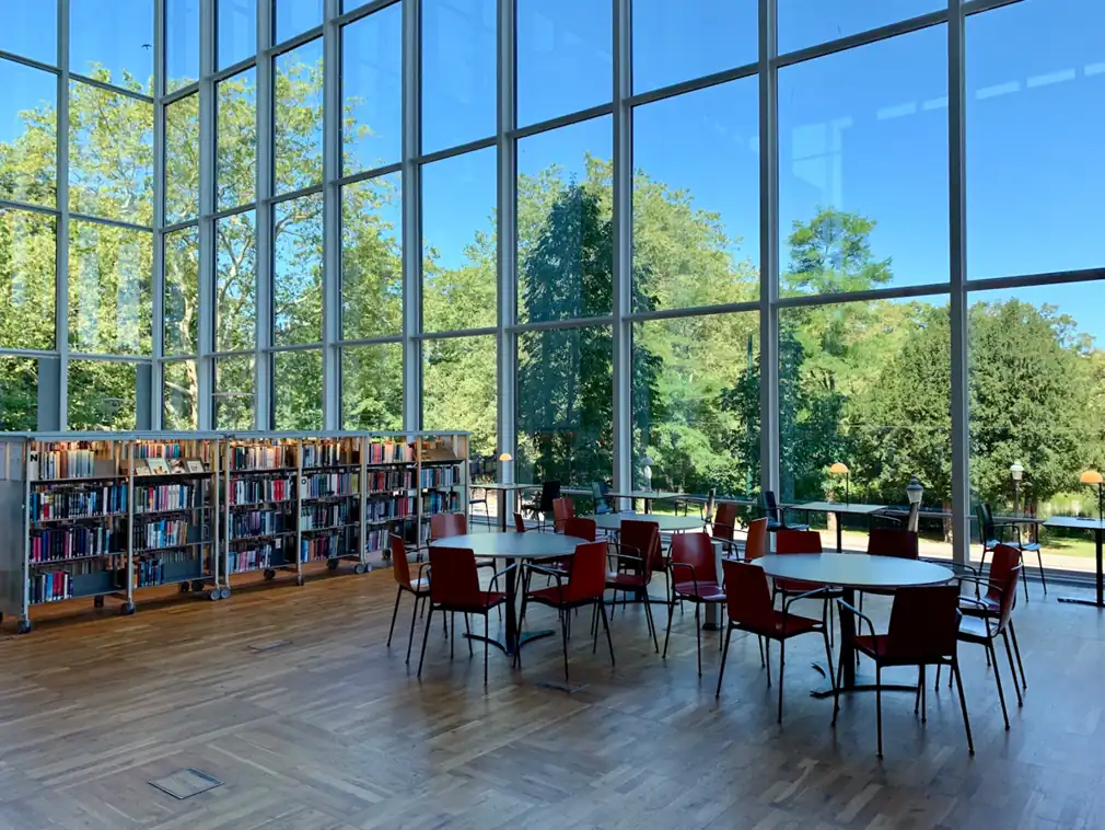 Library reading area beside large windows