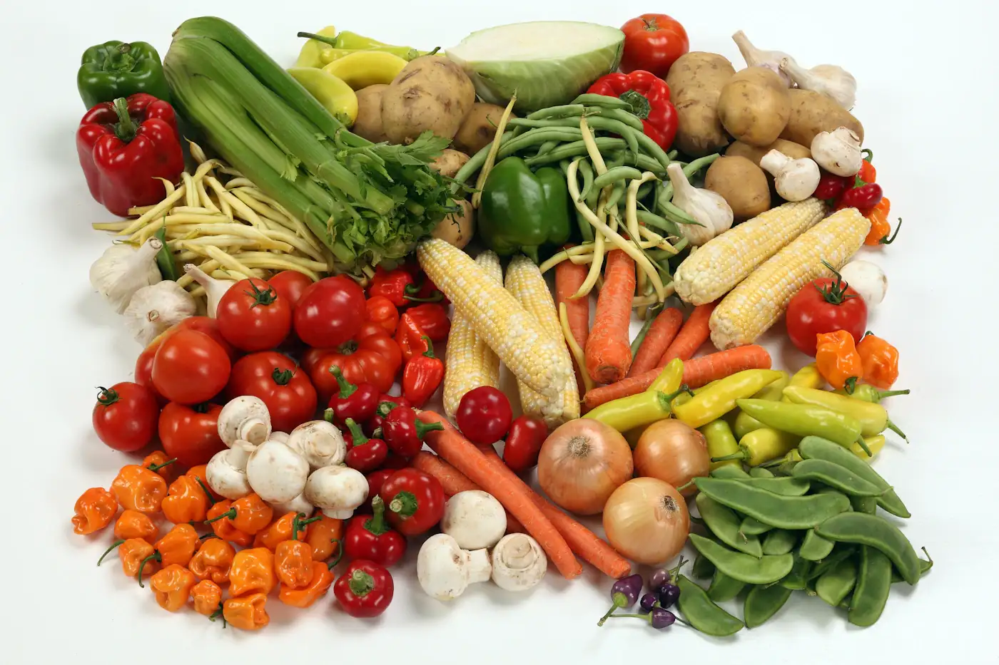 Fresh vegetables arranged on a light surface