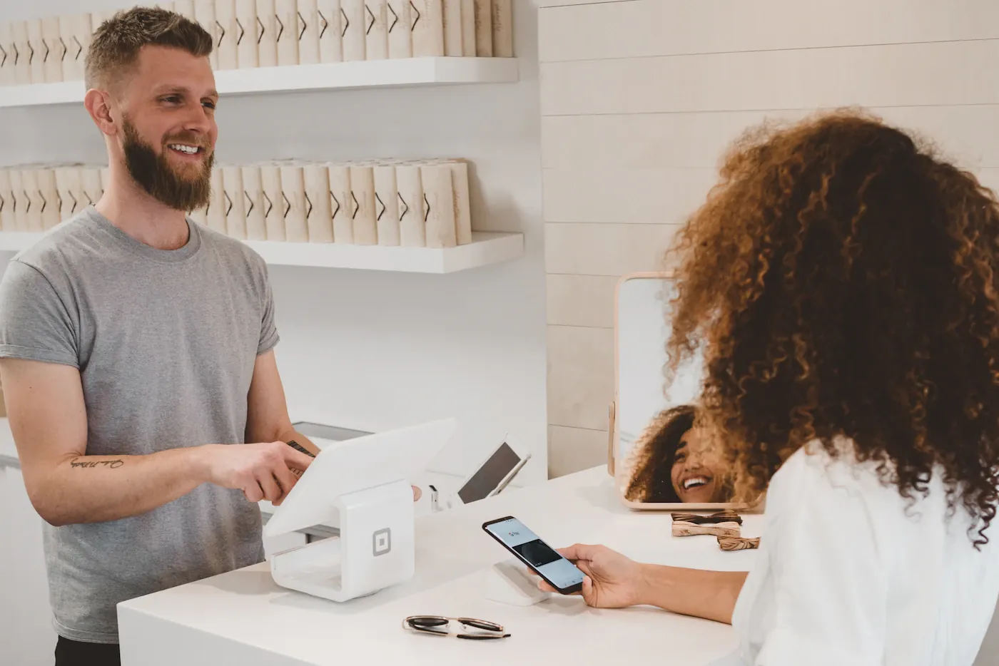 Customer and staff member at a shop counter