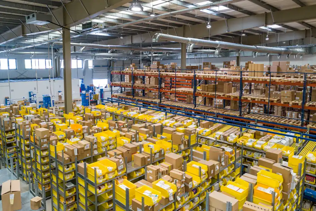 Conveyor and shelving inside a large distribution building