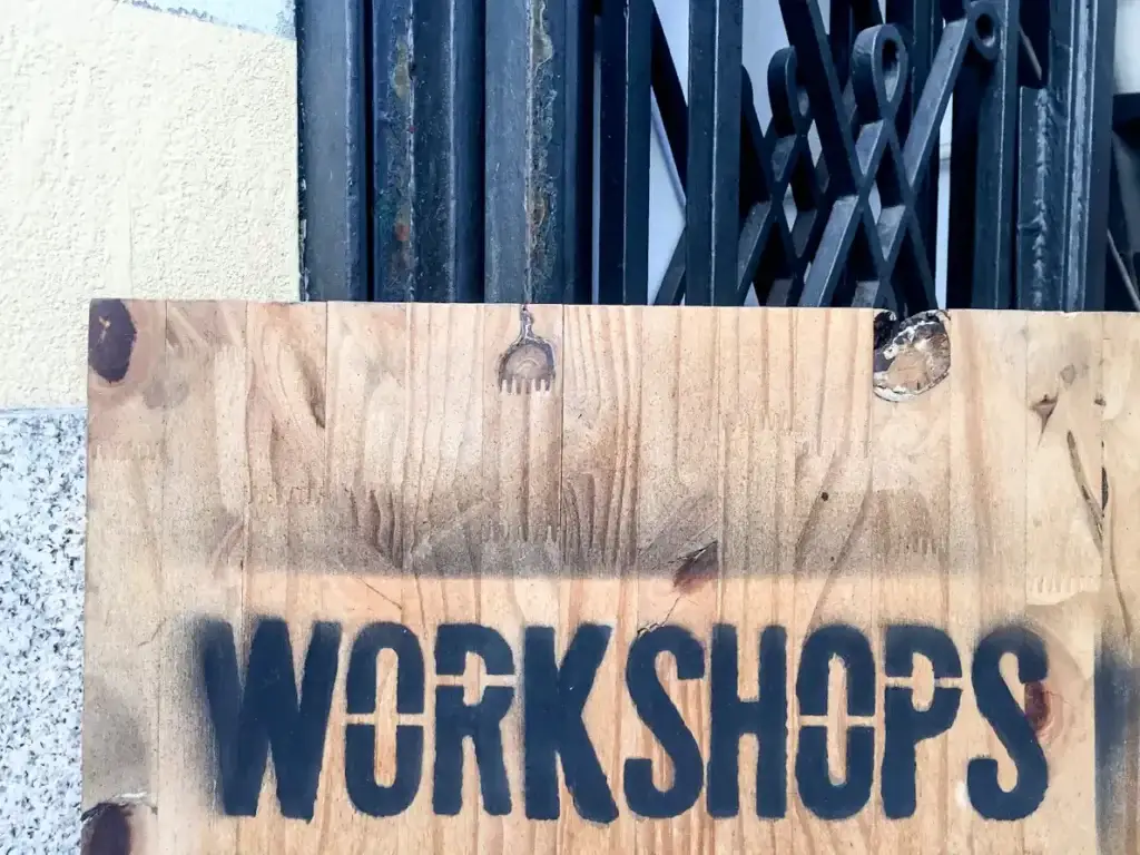 Wooden workshop sign outside a building